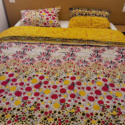 ​Reversible duvet + pillowcases in wax fabric,