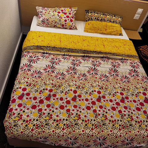 ​Reversible duvet + pillowcases in wax fabric,